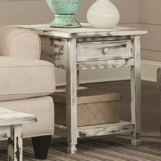 a living room scene with focus on the end table and chair, which has been painted white