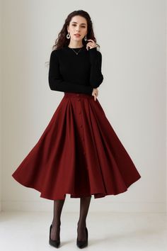 This skirt effortlessly combines style and comfort. The A-line silhouette offers a flattering fit, while the high-quality wool fabric ensures warmth and softness. The button-down detail adds a touch of sophistication to this versatile skirt, suitable for various occasions. DETAIL * 30% wool, 30% fiber, 40% polyester * fully satiny liner * Two side pockets * Right zip closure * elastic band at the back to provide some stretch * Plus size full skirt * Mid calf length * Perfect for Winter, autumn * Learn More about the items From the FAQs on the page bottom MODEL SIZE Bust 85 cm(33.4")  Waist 67 cm(26.7")  Height 168cm (5' 6") She wears size XS CUSTOM MADE SERVICE If you * Change other color * Can't find your size in our size Chart * Change the Style * Change the length * Your Height is not B Burgundy Wool Skirt, Outfits For A Wedding Guest Winter, Warm Skirts For Winter, Fall Thanksgiving Outfits For Women, Cute Skirt Winter Outfits, Christmas Modest Outfits, Vintage Inspired Fall Outfits, Midi Skirts Ideas, Warm Brown Outfit