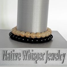 This game day Central Florida football fan two bracelet stack is made of semi precious gemstones (dyed black and golden jade, and hematite spacers). This school pride bracelet stack is stretch elastic, and fits a size 7 inch wrist +-. SIZE & DETAILS > Stretch elastic beaded     college/university fan     Two bracelet stack > Dyed black and golden     jade 8mm beads > Polished hematite rondels CUSTOM & SIZE OPTIONS  > If you do not find your     specific size, etc., I     welcome custom order Black Team Spirit Jewelry For Game Day, Adjustable Black Team Spirit Jewelry, Sporty Team-colored Beaded Bracelets For Sports Events, Modern Black Hand-strung Beaded Bracelets, Spiritual Yellow Gold Hand-strung Beaded Bracelets, Florida Football, Colleges In Florida, College Colors, Pride Bracelet