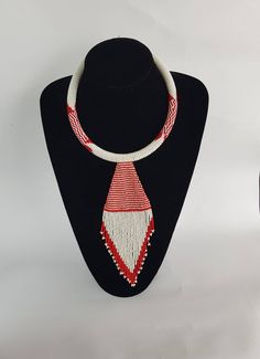 This necklace is a perfect for zebra lovers. 100% handcrafted using fine beads. The necklace is 19 inches long and 4 inches pendant. The closure is an S shape clasp. **Buy multiple items and pay shipping for 1 item only.The rest ships free. More neckleces here; https://www.etsy.com/shop/TribalTess?ref=seller-platform-mcnav&section_id=21306083 Back to my shop; https://www.etsy.com/shop/TribalTess?ref=seller-platform-mcnav Unique White Choker Necklace, White Polished Beads Pendant Jewelry, White Polished Bead Pendant Jewelry, Unique White Adjustable Necklace, Unique White Choker Jewelry, Unique White Choker, Traditional White Beaded Pendant Necklace, Handmade White Choker Necklace, White Pendant Choker As Gift