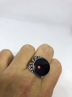 Vintage Onyx Mens Ring 925 Sterling Silver Gothic Genuine Black Onyx Cool Vintage Rock and Roll star men's ring Nice heavy ring, Sterling silver set with genuine black Onyx Unused stock from the 1970's I have an assortment of sizes from 9, 10, 11 or 11.5 These can be resized by my jeweler for a $10 fee Please add your size to the order in a message and I will send the size you require. All jewelry is shipped in a nice gift box. Check out our over a THOUSAND great reviews We now can custom size t Classic Black Enamel Ring, Black Sterling Silver Signet Ring, Black Signet Ring With Polished Finish, Mens Stainless Steel Rings, Vintage Rock, Mens Ring, Heart Locket, Vintage Jewels, Cool Vintage