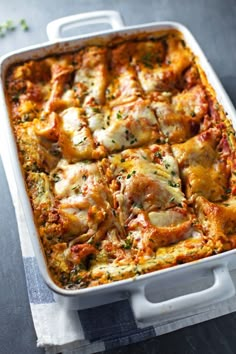 a casserole dish filled with meat and cheese