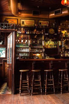 a bar with stools in front of it