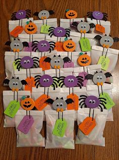 bags with halloween decorations on them sitting on a table