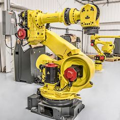 an industrial robot is sitting in a warehouse