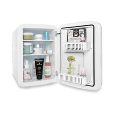 an open refrigerator with its door wide open and shelves full of cosmetics, skin care products