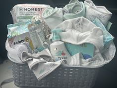 a basket filled with baby items sitting on top of a table