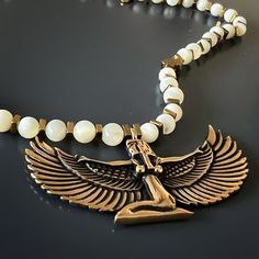 Egyptian Goddess Isis Spiritual Necklace Jewelry reflects the wearer's personality, style and outlook to life. For this reason, I believe the jewelry we wear should be meaningful and have an unique and positive vibe. With their unique design, jewelry should reflect your unique style, and with their meaning, jewelry should display your soul, personality and vibe. That's my philosophy when I design my pieces each with their own unique design, story, and meaning. With the symbols of good luck and p Symbolic Round Beads Necklaces As Gift, Symbolic Round Beads Necklaces For Gifts, Symbolic Beaded Necklaces For Gifts, Symbolic Beaded Necklace For Gift, Brass Beaded Necklace With Gemstone Beads As Gift, Symbolic Beaded Necklace Gift, Symbolic Handmade Round Beads Necklace, Bronze Beaded Necklace With Polished Beads As Gift, Bronze Necklace With Polished Beads As Gift