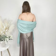 A white pashmina scarf is versatile and will go with any bridesmaid dress and match any wedding theme. Its simply a classic and a must for winter and chilly outdoor weddings! Our wedding pashminas are extremely soft and will keep your guests warm at your wedding reception and they are great pashmina wedding favors for your guests as they are high quality. A prefect bridesmaid proposal gift is a white bridesmaid pashmina! A pashmina scarf is also a great favor gift for guests at a bridal shower, Formal Elegant Pashmina Shawl, Elegant Fall Pashmina Shawl, Elegant Formal Pashmina Scarves, Elegant Solid Color Shawl For Fall, Elegant Winter Pashmina Shawl, Elegant Pashmina Shawl For Evening, Elegant Winter Formal Pashmina Shawl, Elegant Winter Pashmina Shawl For Formal Occasions, Elegant Solid Color Pashmina Scarves