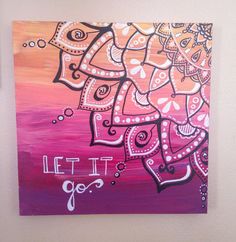 a painting on a wall with the words let it go written in white and pink