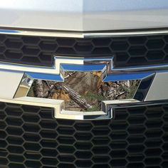 the front end of a chevrolet car with its grilles and emblem on it's grill