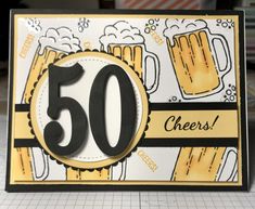 a 50th birthday card with beer mugs and the number 50 on it's front