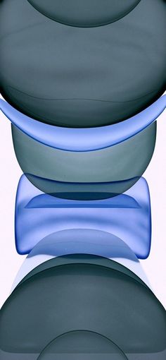 three stacks of blue and gray plates stacked on top of each other in front of a white background