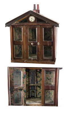 an old wooden doll house with glass doors and window panes on the front, inside and outside