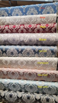 several different types of fabric on display in a store