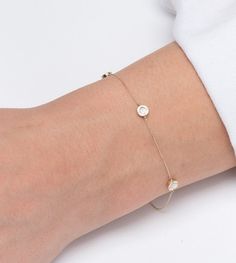 Buy a unique Mother of Pearl circle bracelet for women. | Discover a large collection of everyday sparkling jewels. | ✅ We offer FREE Worldwide Shipping. 📌About the bracelet: Our dainty bracelet is made from 14 karats solid gold and has four circles from mother of pearl and four cubic zirconia stones on each side. The bracelet is double-sided. It is a really shiny and sparkling bracelet that can be worn alone or as part of a layering set. 📏Dimensions approximately: Width circles 5,22 mm, 0,205 Modern White Round Diamond Bracelet, Modern White Gold Bracelet For Everyday Luxury, Modern White Gold Luxury Bracelet, Elegant Bezel-set Bangle Jewelry, Elegant Round Diamond Bracelet, Tarnish Resistant, Elegant Round Tarnish Resistant Diamond Bracelet, Everyday Luxury 14k Gold Round Bracelets, Modern 14k Gold Jewelry In Diamond White, Everyday Luxury 14k Gold Bracelets