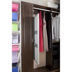 an open closet with clothes hanging on it