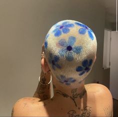 a woman with blue flowers painted on her back