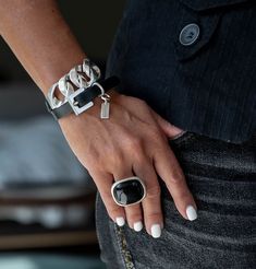 "Uniquely edgy wrap style bracelet with genuine black leather and chunky links with buckle clasp. Bracelet wraps around wrist to form a double bracelet. The finishing touch? A chunky buckle adds to its design. Details: - Width of leather strap: 10cm - All silver elements are Zamak. Zamak metal is used which is a metal alloy deeply coated in silver and imported directly from Spain. It is world known for its weight, luster and durability. Contains sterling silver and is anti-allergic, nickel and lead-free - Bracelet is adjustable and can be tighten to fit smaller or larger wrists but knowing your size helps me create it to fit you perfectly! Sizes: XS (6.5\"/16.51CM) S (7\"/17.78CM) M (7.5\"/19.05CM) L(8\"/20.32CM) XL (8.5\"/21.59CM) ❥❥Thank you for visiting my store! The purpose of each pie Luxury Adjustable Edgy Bracelets, Biker Chic Jewelry, Affordable Chic Metal Cuff Bracelet, Luxury Sterling Silver Bracelet With Chunky Chain, Luxury Silver Artistic Cuff Bracelet, Luxury Silver Chic Cuff Bracelet, Luxury Elegant Sterling Silver Bracelet With Chunky Chain, Luxury Black Chic Cuff Bracelet, Luxury Artistic Silver Cuff Bracelet