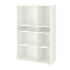 a white bookcase with four shelves on each side