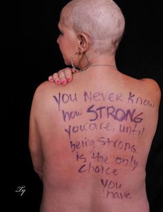 the back of a woman's upper body with writing on it and words written in purple ink