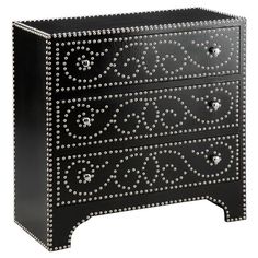 a black and white dresser with studded drawers