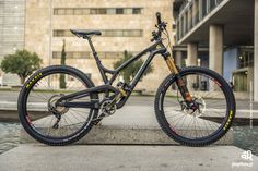 a mountain bike parked in front of a building