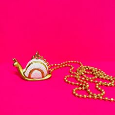 The most adorable snail necklace, with bright metallic gold! **WARNING** This item is not a toy and is not intended for use by children under three years of age. Necklaces have small parts and could cause choking. Do not put in mouth. By purchasing you are assuming all responsibility for these pieces and the supervision of your child. Snail Necklace, Horse Necklace Kids, Gender Free, Free Baby Shower, Event Gifts, Baby Kids Clothes, Accessory Pouch, Free Baby Stuff, Metallic Gold