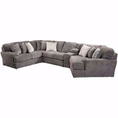 a large gray sectional couch with pillows on the top and bottom corner, in front of a white background