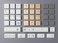 various electrical outlets and plugs are arranged on a gray surface, including one for each outlet