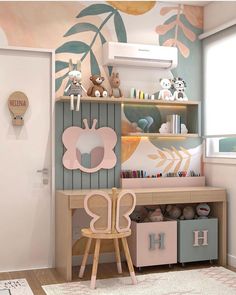 a child's room with an animal theme on the wall