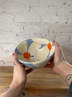 a person holding a bowl in their hands