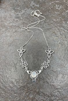 "I've fabricated a Celtic Irish inspired necklace with a center Celtic knot which features a center 8mm round cabochon, of your choosing in the drop down menu, with a total of three component pieces on either side. The sterling chain of 16 inches is soldered to each end making the approximate length of this piece just a bit over 18\" total. The chain will have a sturdy lobster claw. I've fabricated everything in sterling silver - it's a heirloom piece! This is a beautiful and feminine statement Irish Necklace, Irish Wedding, Inspired Necklace, Irish Celtic, Gifts For My Wife, Moonstone Necklace, Choker Necklaces, Girly Jewelry, Moon Pendant