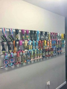 there are many medals hanging on the wall