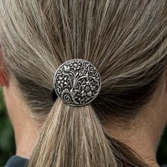 Our elegant Ponytail Holders are a wonderful addition to our line of Hair Accessories. Available in eight popular images. Product Features: - Highest quality, replaceable "ouchless" elastic hair band - Hand cast, lead free, food grade Britannia metal Weight: 0.4 oz. Dimensions: 1.35" Diameter Learn about Britannia Metal care here Silver Silverware, Celtic Hair, Popular Images, Elegant Ponytail, Norse Jewelry, Celtic Knot Ring, Art Deco Pendant, Crystal Design, Ponytail Holder