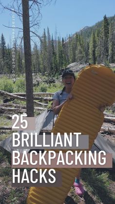 a woman holding a large yellow backpack in the woods with text overlay reading 25 brilliant backpacking hacks