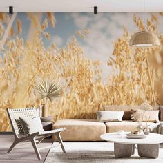 a living room with couches and chairs in front of a wall mural that has wheat stalks on it