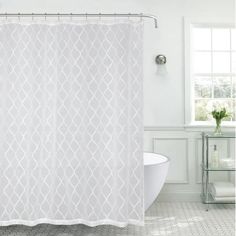 a white shower curtain in a bathroom