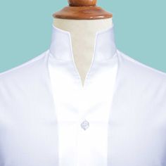 Elegant Stand Collar Top With Buttons, Elegant Tops With Collar And Concealed Placket, Elegant Tops With Concealed Placket And Collar, Classic White Shirt With Covered Buttons, Classic Stand Collar Tops For Work, Classic Stand Collar Top For Work, Classic Tops With Detachable Collar For Work, Elegant Semi-formal Tops With Stand Collar, Classic Dress Shirt With Concealed Placket For Daywear