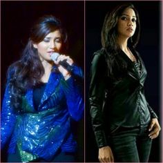 two women in black and blue outfits one is singing into a microphone while the other has long dark hair