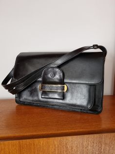 Description:  Vintage Adjustable Black Top Handle Handbag. Four compartments, beige velvet lining, Adjustable StrapMeasurements:Height: 22cm, Width: 32cm, Bag to Strap: 23cm, or 44cm Vintage Appreciation Society: Online and Instore @vintageappreciationsociety and @handbagappreciationsociety Formal Shoulder Bag With Removable Pouch, Classic Satchel Baguette Bag For Business, Formal Satchel Shoulder Bag With Detachable Strap, Formal Satchel Shoulder Bag With Removable Pouch, Classic Flap Bags For Formal Occasions, Classic Satchel Baguette Bag For Formal Occasions, Formal Satchel Shoulder Bag With Adjustable Strap, Formal Shoulder Bag With Adjustable Strap, Vintage Baguette Shoulder Bag For Evening