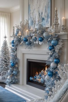 a fireplace decorated with blue and silver ornaments