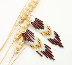 These hoop earrings are made using traditional freehand beading techniques. Earrings are made of quality Czech beads and strong thread. 925 silver hooks. Earrings are 10.5 cm ( 4.1 inches)  length and 2 cm ( 0.8 inches) width. Colors: brown,blue,honey yellow. 100% handmade. See more of hoop earrings here: https://www.etsy.com/shop/SandasHandmades?ref=seller-platform-mcnav§ion_id=45537799 See the rest of shop here: https://www.etsy.com/shop/SandasHandmades The photo may not convey true colors. Th Earrings Handmade Boho, Hoop Earrings Handmade, Handmade Boho Jewelry, Beading Techniques, Jewellery Gift, Seed Bead Earrings, Czech Beads, Handmade Boho, Bead Earrings