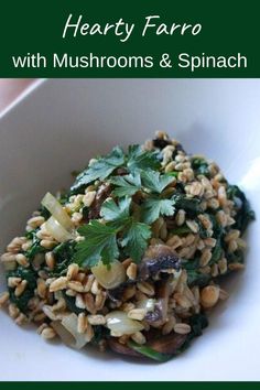 a white bowl filled with mushrooms and spinach