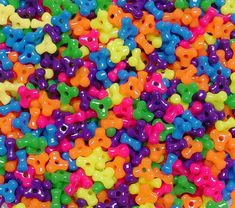 there are many different colors of beads in this photo, including multi - colored bears