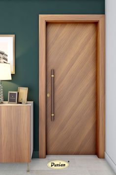 a wooden door in a room next to a night stand with a lamp on it