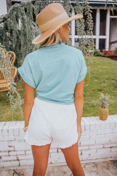 People are sure to mention how great you look in this sky blue top featuring lightweight material, a button down front with a rounded neckline, short sleeves with rolled cuffs, a single accent chest pocket, and a slouched silhouette that ends in a tied front hemline and a straight back hem! Blue Cotton Tops With Cuffed Sleeves, Trendy Summer Tops With Cuffed Sleeves, Casual Summer Short Sleeve Top, Light Wash Cotton Tops For Vacation, Relaxed Fit Tops With Cuffed Sleeves For Day Out, Summer Tops With Roll-up Sleeves For Casual Gatherings, Relaxed Fit Cuffed Sleeves Tops For Day Out, Light Blue Tops With Pockets For Spring, Casual Tops With Roll-up Sleeves For Vacation