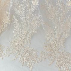 Width: 130cm, in inches: 51"The listing is for 1 yards.For more quantity, please feel free to convo me.If you like it, order it now.Perfect choice for a touch of ador for wedding gown / bridal dress decor, bodice , wedding dress applique, bridal headpiece applique, evening gown applique, sash applique, wedding cale candle applique , bridal accessories ,wedding projects. llhttps://www.etsy.com/shop/beautyfabric Cream Lace Wedding Dress For Debutante Ball, Cream Floral Embroidered Fabric For Wedding, Cream Wedding Embroidered Fabric, Embroidered Tulle Lace For Wedding, Wedding Lace With Embroidered Tulle, Beige Intricately Embroidered Fabric For Wedding, Cream Embroidered Wedding Dress, Cream Tulle Fabric With Intricate Embroidery For Wedding, Wedding Tulle Fabric In Cream With Intricate Embroidery