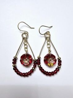 Red And Gold Czech Flower Dangle Hoop Earrings 2. 3/4 inches Long Red And Gold Czech Flower Earrings 2 - 14mm Hawaiian Hibiscus Red Pansy Czech Glass Flower Beads 24 - 4mm 6/0 Glass Red Seed Beads 8 - 4mm Gold Round Metal Beads 2 -  4mm Gold Oval Chain Components 2 - 8mm Gold Jump Rings 2 - 25x45mm Gold Tear Drop Hoops 2 - Handmade Gold Ear Wires "New excellent condition handmade jewelry has never been worn." Handmade Beaded Jewelry - is a popular choice for many due to its unique Fashions and One-of-a-kind styles. Customers can return jewelry for free repairs if needed.  Please note that if the jewelry is returned for repairs the customer is responsible for all shipping costs Nickel Free Teardrop Metal Flower Earrings, Nickel-free Metal Teardrop Flower Earrings, Handmade Adjustable Teardrop Flower Earrings, Bohemian Teardrop Hoop Earrings With Ear Wire, Bohemian Teardrop Nickel Free Hoop Earrings, Red Teardrop Hoop Earrings With Ear Wire, Adjustable Teardrop Flower Earrings, Wire Wrapped Teardrop Hoop Earrings, Festive Teardrop Jewelry With Ear Wire