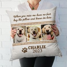 a woman holding a pillow with three dogs on it and the words, when you miss me have no fear, hug the pillow and know in here